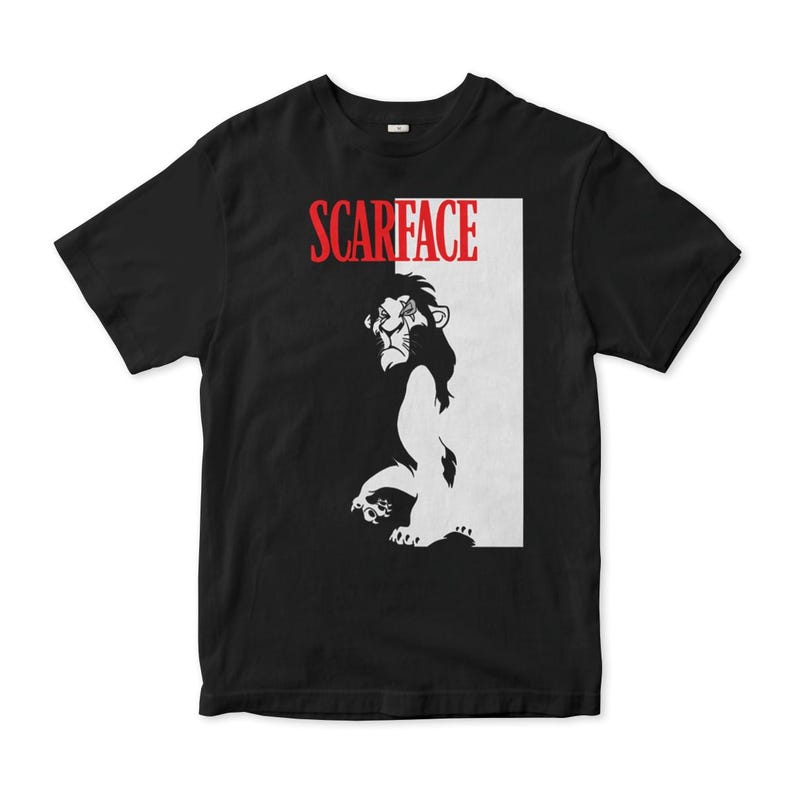 May include: Black t-shirt with a white and black image of Scar from The Lion King. The text "SCARFACE" is printed in red above the image.