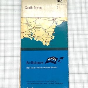 May include: A vintage map of South Devon, Great Britain, with detailed topographical features. The map is split into cream and blue sections, with the text "South Devon" and "Bartholomew" visible. The map is printed by John Bartholomew & Son Limited, Edinburgh.