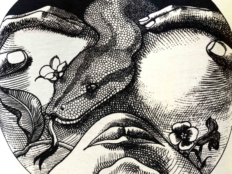 May include: Black and white illustration of a snake wrapped around two hands, with flowers and leaves in the background.