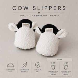 May include: A pair of white and black cow slippers with textured fleece material, featuring small ears and a label reading myggpp. The text reads COW SLIPPERS, SOFT, COZY & MADE FOR TINY FEET, with icons for ultra soft, lightweight, and non-slip sole features.