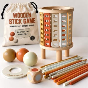 May include: A wooden stick game set featuring a cylindrical tower with orange, cream, and tan slats, a beige drawstring bag labeled "WOODEN STICK GAME," three colored balls, a wooden die, a circular base, and several thin colored sticks.