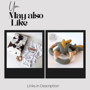 May include: A white baby bodysuit with the text NEW COWBOY IN TOWN, a white and brown cow print blanket, and a small brown ring. Next to it, a corn-shaped teether with a wooden ring and olive green silicone parts labeled Food Grade Silicone.