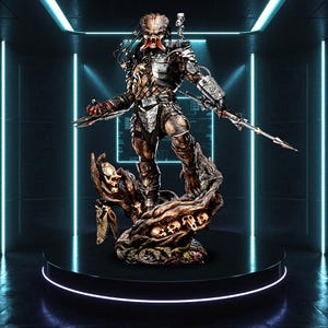 May include: A detailed statue of a Predator alien warrior, standing on a tree trunk base adorned with skulls. The figure is clad in metallic armour and holds bladed weapons. The statue is displayed on a black circular platform with a neon blue light.