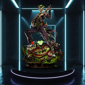 May include: A detailed statue of the Joker, a DC Comics supervillain, in a dynamic pose. The figure wears a purple suit, green vest, and red socks. The base features a detailed, colorful scene with Harley Quinn. The statue is on a black pedestal.
