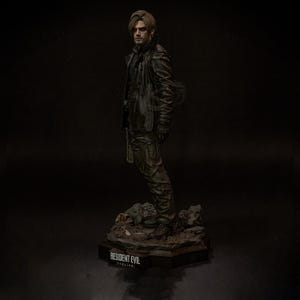 May include: A detailed figurine of a character from the Resident Evil franchise. The figure is dressed in a black leather jacket and pants, standing on a detailed base. The figure is approximately 12 inches tall.
