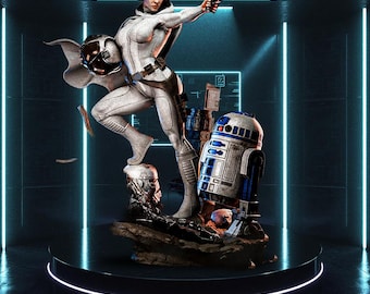 May include: A detailed statue of a character in a white jumpsuit, holding a blaster and a helmet, with R2-D2 and other props. The figure is standing on a rocky base on a black platform, with a futuristic background.