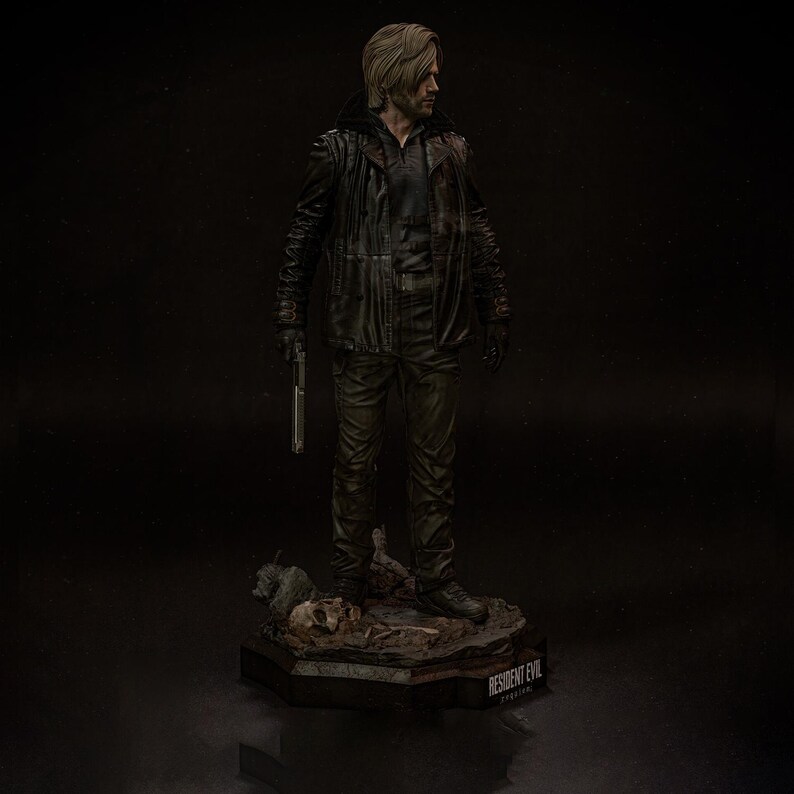 May include: A detailed figurine of a character from Resident Evil, dressed in a black leather jacket and pants, holding a silver pistol. The figure stands on a base with the game's logo. The figure has blonde hair and is looking to the side.