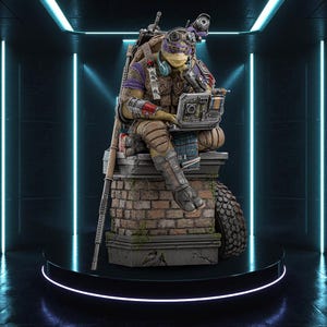 May include: A detailed statue of Donatello from Teenage Mutant Ninja Turtles, seated on a brick structure. He wears goggles, a purple and brown outfit, and is using a laptop. The statue is displayed on a round, illuminated platform.