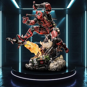 May include: A detailed statue of Deadpool in a red and black costume, captured mid-action with weapons. The figure is positioned on a detailed base with a fiery explosion effect, set against a neon-lit background.