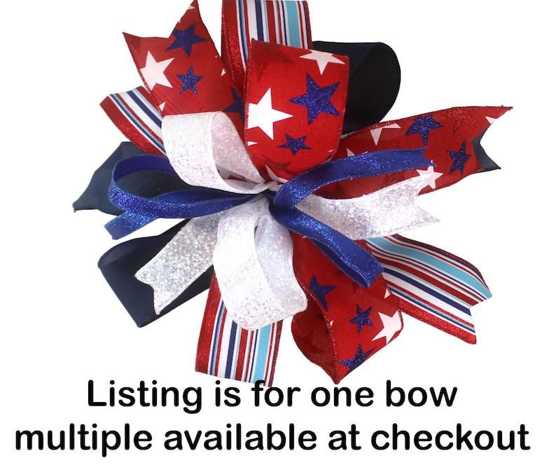 May include: A decorative bow featuring red, white, and blue ribbons. The bow has a patriotic theme with star and stripe patterns. The text "Listing is for one bow multiple available at checkout" is visible.