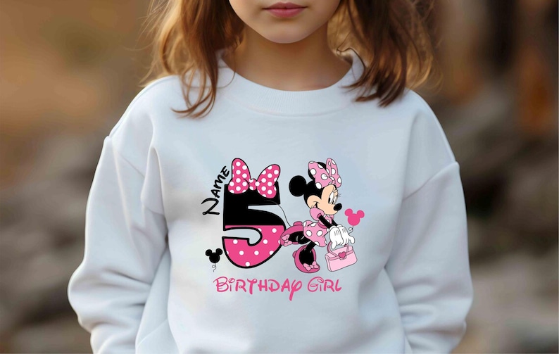 May include: White sweatshirt with a pink Minnie Mouse graphic and the text "Name 5 Birthday Girl".