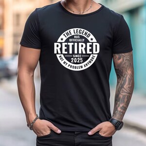 May include: Black t-shirt with a white circle graphic that says "The Legend Has Officially Retired Since 2025 Not My Problem Anymore".