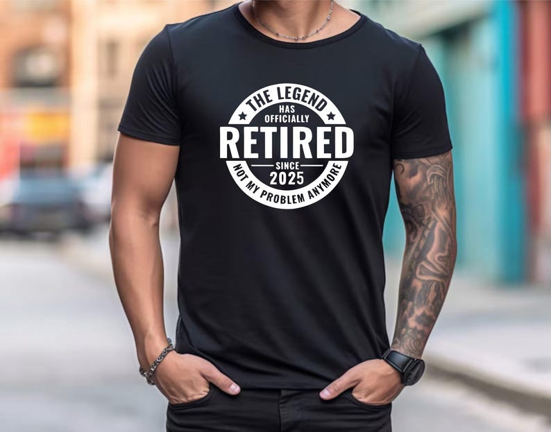 May include: Black t-shirt with a white circle graphic that says "The Legend Has Officially Retired Since 2025 Not My Problem Anymore".
