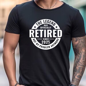 May include: Black t-shirt with a white circle graphic that says "The Legend Has Officially Retired Since 2025 Not My Problem Anymore".