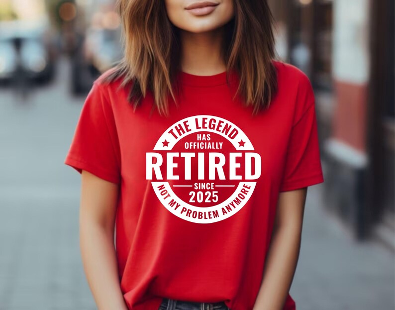 May include: Red t-shirt with a white circle graphic that says "The Legend Has Officially Retired Since 2025 Not My Problem Anymore".