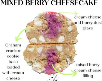 May include: A close-up of a mixed berry cheesecake cookie. The cookie is cut in half, revealing a graham cracker cookie base, cream cheese chips, and a mixed berry cream cheese filling. The top of the cookie is topped with cream cheese and berry dust glaze.
