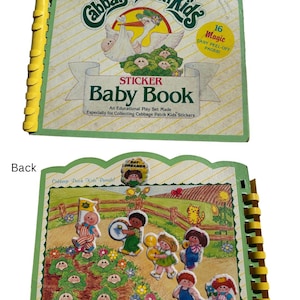 May include: A vintage Cabbage Patch Kids sticker baby book. The front cover features the Cabbage Patch Kids logo, a stork carrying a baby, and the text "Sticker Baby Book." The back cover shows Cabbage Patch Kids characters in a parade scene. The book has 16 peel-off pages.