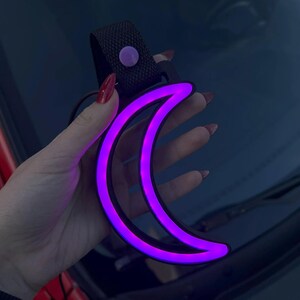Moon Tsurikawa neon LED car decor accessory designed for JDM fans and aesthetic drivers, perfect for car interiors, dorm rooms, or gaming setups. Adds a subtle ambient glow that creates a relaxing, dreamy, and slightly celestial atmosphere.