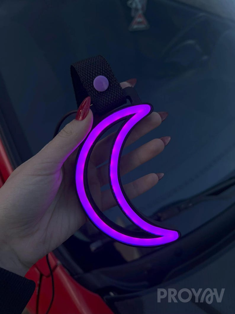 Moon Tsurikawa neon LED car decor accessory designed for JDM fans and aesthetic drivers, perfect for car interiors, dorm rooms, or gaming setups. Adds a subtle ambient glow that creates a relaxing, dreamy, and slightly celestial atmosphere.