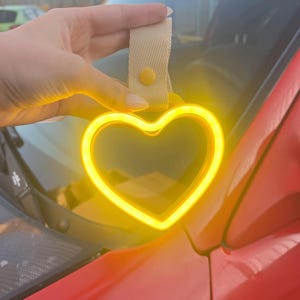 JDM Moon Tsurikawa LED neon handle accessory used in car interiors or as unique room decor, perfect for gift seekers, car lovers, and aesthetic enthusiasts. Brings a soft luminous glow that feels calming, magical, and modern.
