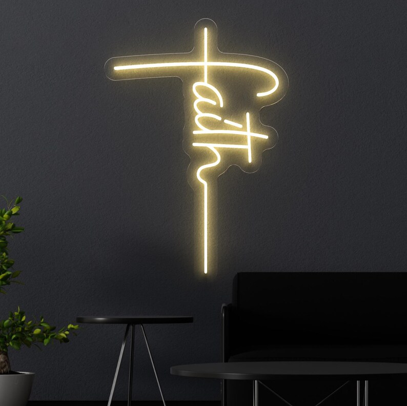 Christian neon sign featuring the word faith written vertically to form the shape of a cross, blending modern style with a powerful religious message. Ideal for spiritual home decor, prayer rooms, church walls, or as a meaningful faith-based gift. This glowing LED light adds inspiration and serenity to any space.