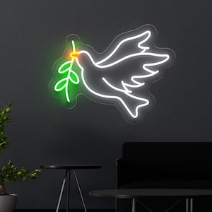 Peace Dove neon sign featuring a glowing dove symbolizing peace, harmony, and divine love. This modern LED light adds a serene and uplifting touch to any room, making it perfect for homes, bedrooms, living rooms, or churches. Its gentle, radiant glow creates a peaceful atmosphere, making it an ideal gift for spiritual and religious occasions like baptisms, confirmations, or as a daily reminder of inner peace and hope.