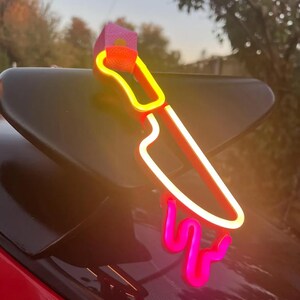 JDM Moon Tsurikawa LED neon handle accessory used in car interiors or as unique room decor, perfect for gift seekers, car lovers, and aesthetic enthusiasts. Brings a soft luminous glow that feels calming, magical, and modern.