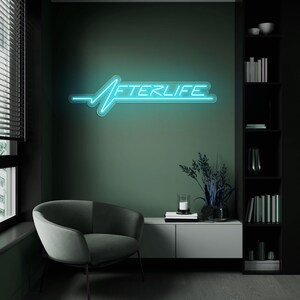 Afterlife LED neon sign for game room decor, bedroom wall art, or bar ambiance. This light-up sign captures a sleek cyberpunk aesthetic, making it an ideal gift for fans of Cyberpunk 2077 or modern sci-fi design. Perfect for man caves, gaming setups