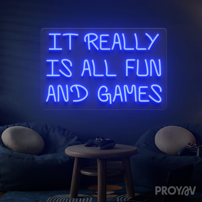 Typography LED wall art with It Really Is All Fun and Games phrase, suitable for bars and lounge interiors, enhancing atmosphere with humor and playful personality.