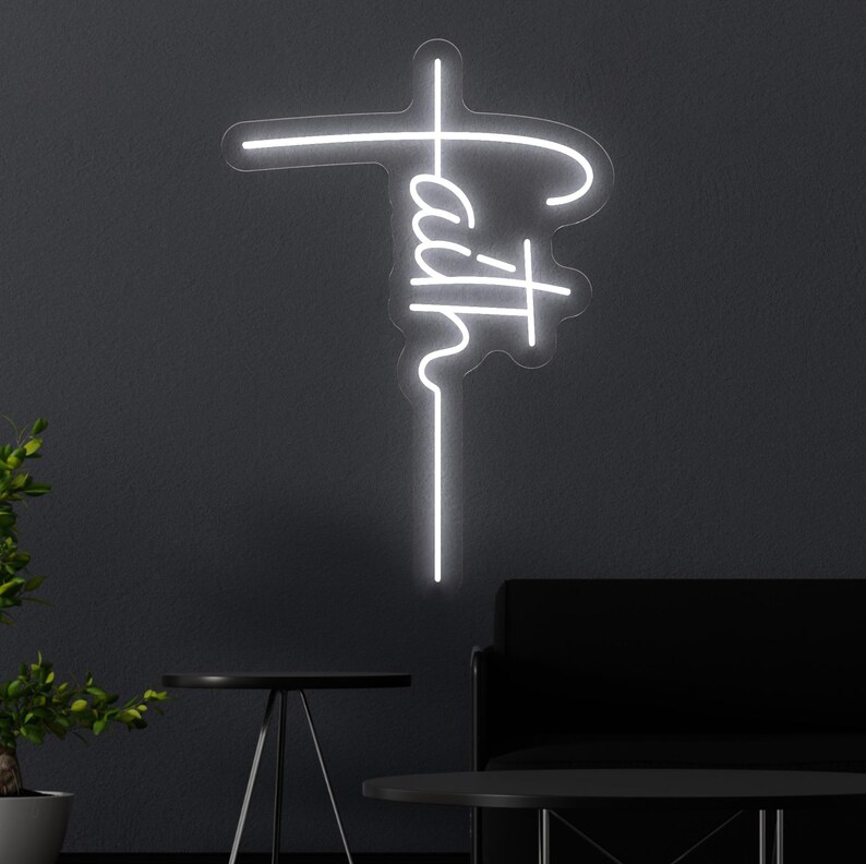 Christian neon sign featuring the word faith written vertically to form the shape of a cross, blending modern style with a powerful religious message. Ideal for spiritual home decor, prayer rooms, church walls, or as a meaningful faith-based gift. This glowing LED light adds inspiration and serenity to any space.