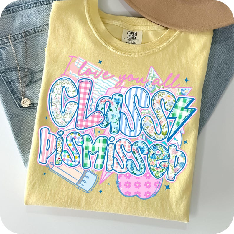 May include: Yellow t-shirt with a colorful patchwork design that says "I love you all Classy Dismissed".