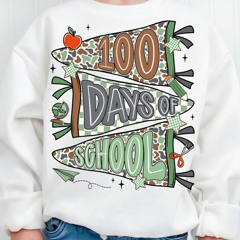 May include: White sweatshirt with a colorful graphic celebrating 100 days of school. The design features pennant banners with the text "100 Days of School" in brown, gray, and green, along with school-themed illustrations like an apple and pencil.