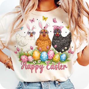 May include: White, brown, and black chickens wearing bunny ears and sunglasses with a pink ribbon. The chickens are surrounded by colorful Easter eggs and flowers. The text "Happy Easter" is written in pink below the chickens.