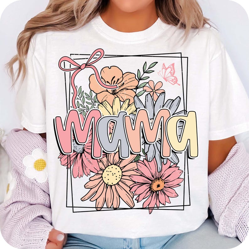 May include: White t-shirt with a floral design and the word "mama" in colorful letters. The flowers are pink, yellow, and orange.