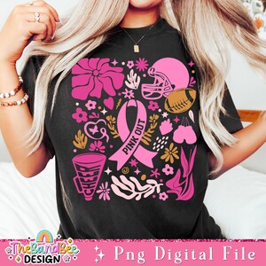 May include: Pink Out design with a pink ribbon, football helmet, football, megaphone, and flowers on a black t-shirt.