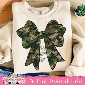 May include: A digital download of a camouflage bow graphic. The bow is green, brown, and black. The graphic is perfect for creating t-shirts, mugs, tote bags, and other crafts.