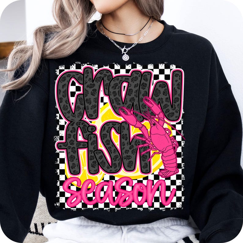 May include: Black sweatshirt with a pink and black graphic that says "Crawfish Season" with a pink crawfish illustration.