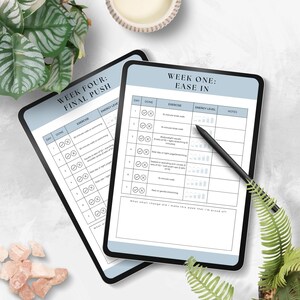 May include: Two digital tablets with blue backgrounds and white text. The top tablet shows a weekly workout plan titled "Week Four: Final Push" with checkboxes for each day of the week. The bottom tablet shows a weekly workout plan titled "Week One: Ease In" with checkboxes for each day of the week. Both tablets have columns for "Day", "Done", "Exercise", "Energy Level", and "Notes".