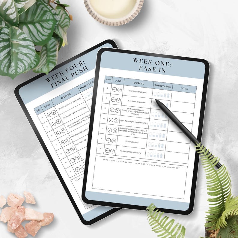 May include: Two digital tablets with blue backgrounds and white text. The top tablet shows a weekly workout plan titled "Week Four: Final Push" with checkboxes for each day of the week. The bottom tablet shows a weekly workout plan titled "Week One: Ease In" with checkboxes for each day of the week. Both tablets have columns for "Day", "Done", "Exercise", "Energy Level", and "Notes".
