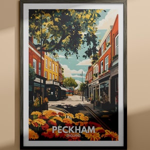 May include: A colourful illustration of a street scene in Peckham, England. The image features a narrow street lined with brick buildings, a tree with green leaves, and a few people walking down the street. The text "Peckham, England" is printed at the bottom of the image.