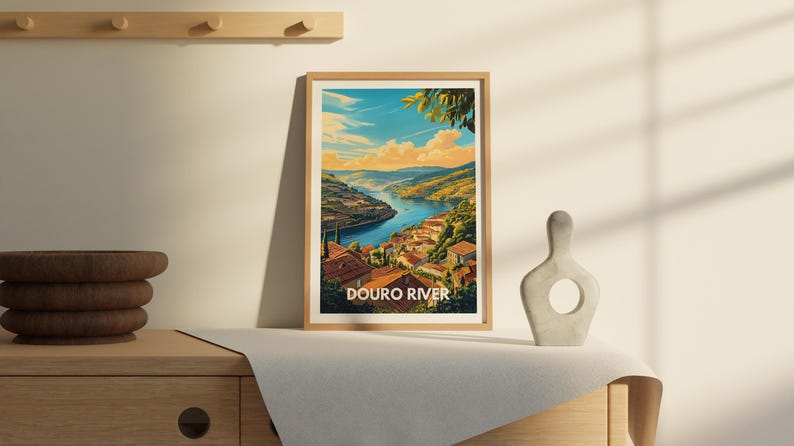 A unique river poster of the Douro is prominently displayed in a modern hallway, complemented by stylish lighting and a console table. The artwork captures the river's peaceful flow, making it a standout piece in the home.