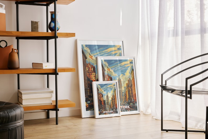 A New York travel poster is featured in a gallery wall in the living room, surrounded by other travel prints.