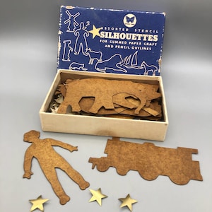 Vintage kaartvormen om te tekenen en gouden gegomde papieren sterren