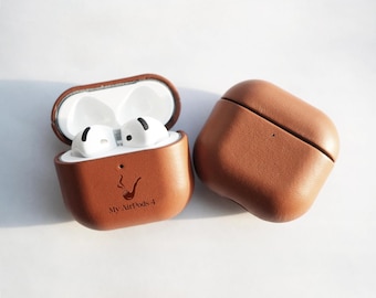 May include: A brown leather case for Apple AirPods with a pipe design and the text "My AirPods 4".
