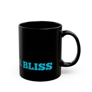 Black mug with the word Bliss in blue lettering