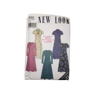 May include: A New Look sewing pattern featuring five dress variations. The pattern envelope displays illustrations of the dresses in various colors and patterns, with text indicating sizes up to 22. The text "Easy Options Five Dress Variations In One" is also visible.