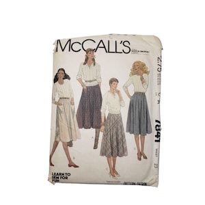 May include: Vintage McCall's sewing pattern envelope featuring illustrations of women's skirts and tops. The envelope is off-white with the text "McCall's" and "Learn to Sew for Fun". The waist size is 23 inches.