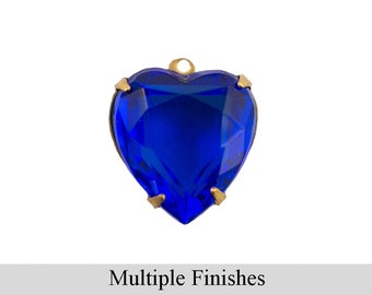 May include: A blue heart-shaped glass charm with gold accents. The charm has a faceted design and is perfect for jewelry making.