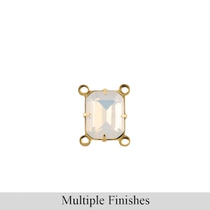 May include: A gold-toned metal setting with a clear, iridescent, rectangular-shaped stone. The setting has four loops for attaching to jewelry.