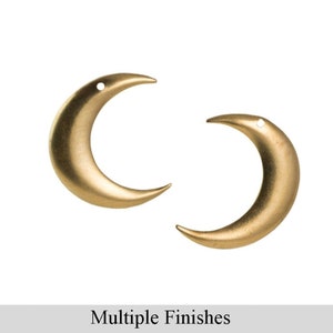 May include: Two gold crescent moon charms with a hole at the top for hanging.